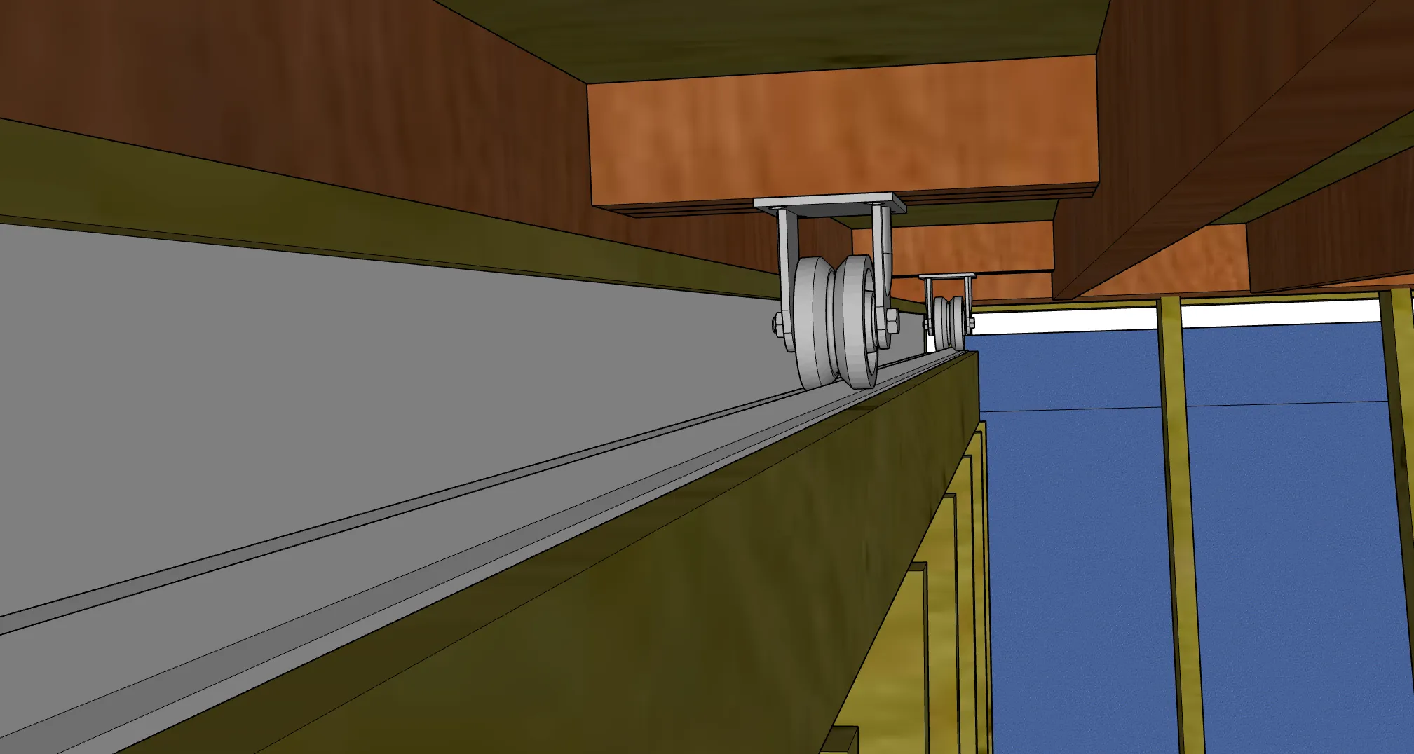 close-up showing the v-groove wheel resting on the angle-iron track