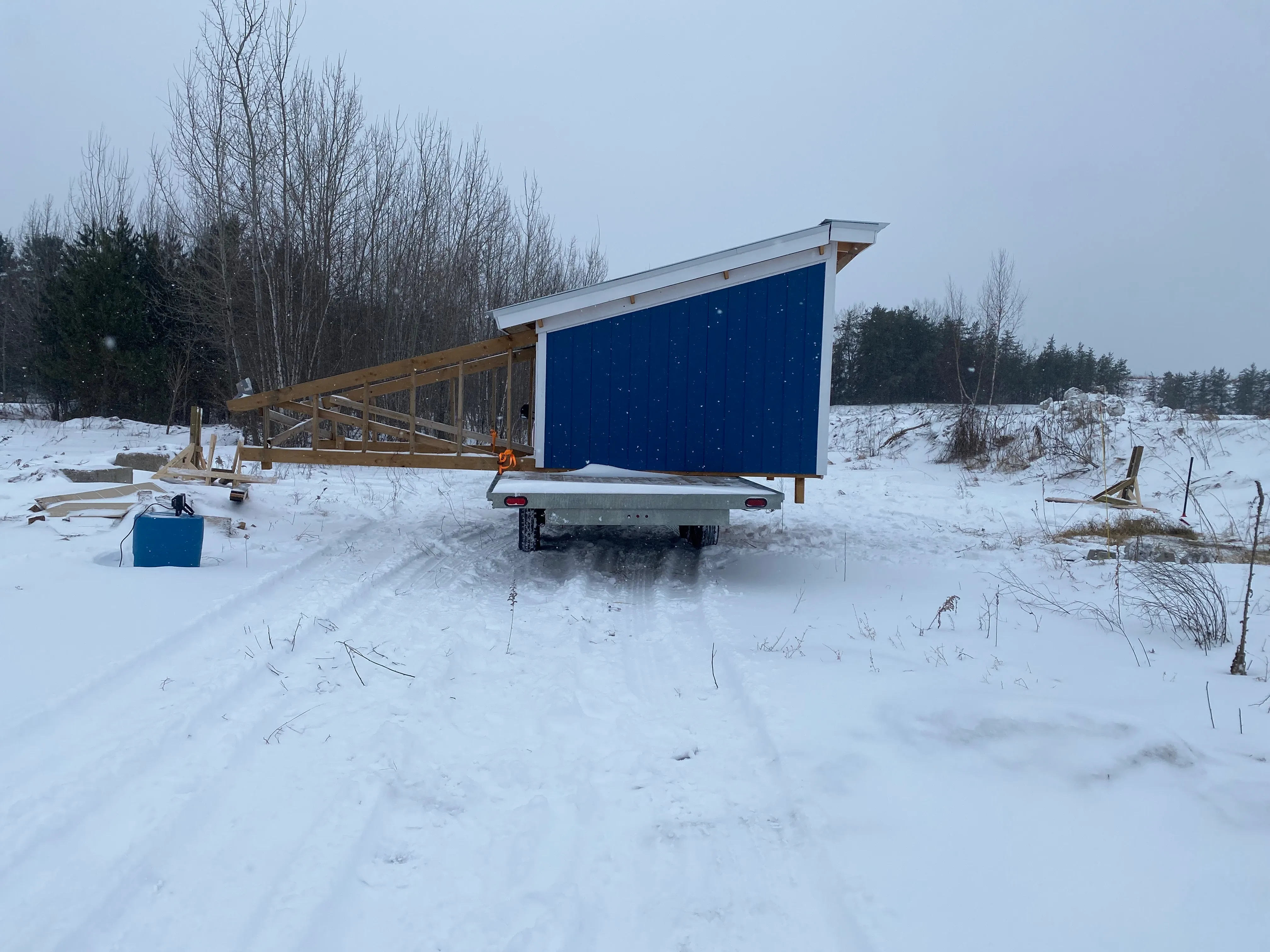 1:00pm: The trailer was now moved to an open position and we could start rotating it. This involved reinstalling the beams and lifting up a few inches so that we could remove the trailer and back it in with the correct orientation.