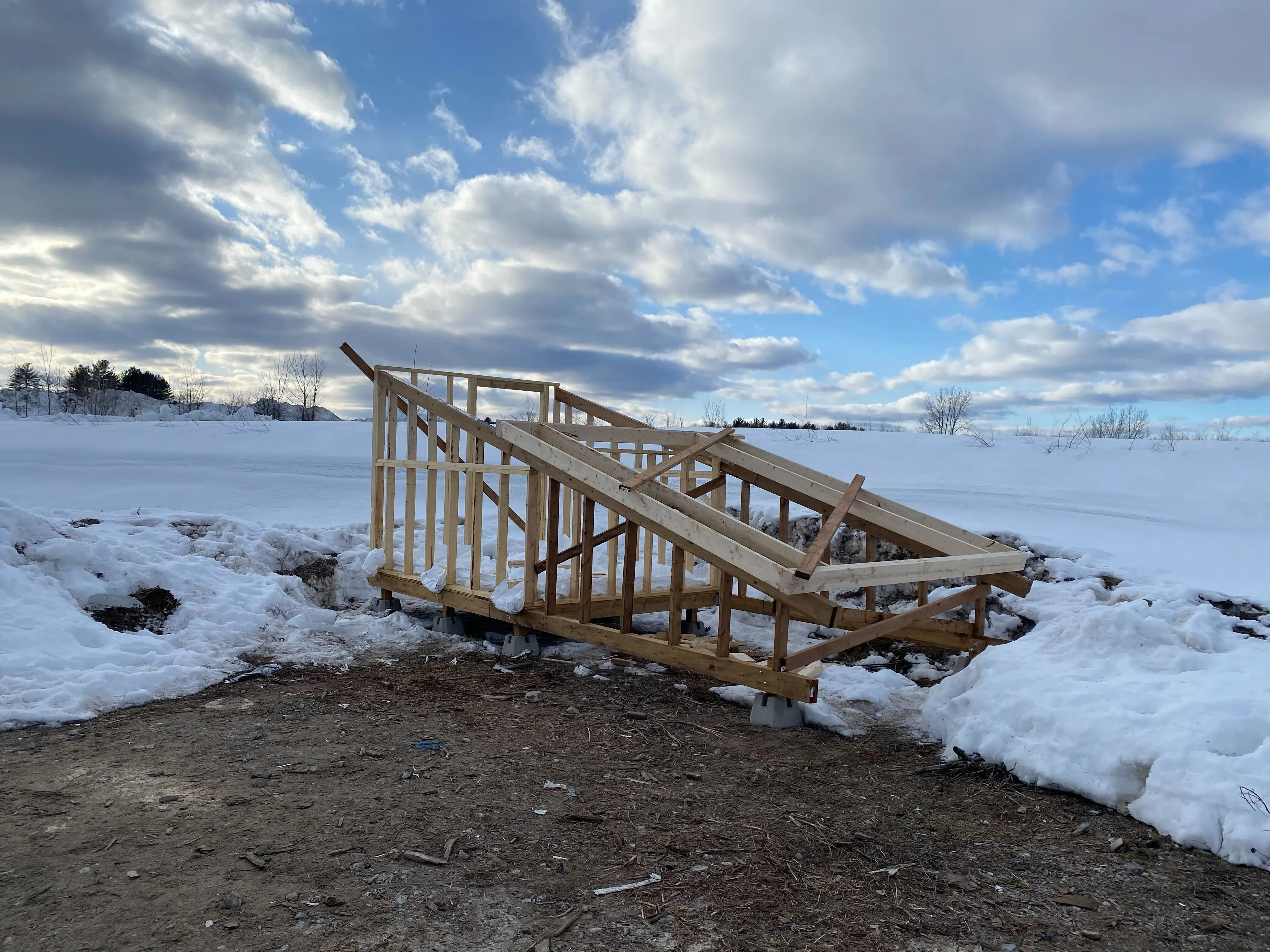 Minimum viable product roof, consisting of a frame, the wheels, and some 2x4s to cross brace it